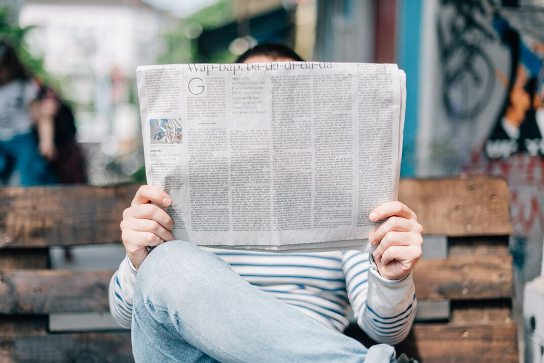 journalist reading newspaper